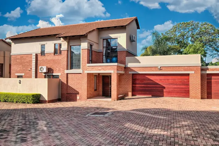 Contemporary South African home with a wide garage door